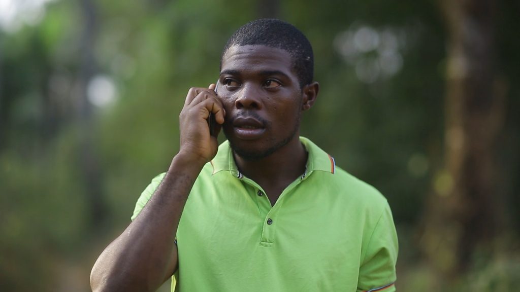 Hidden Sacrifice movie Okoro on the phone