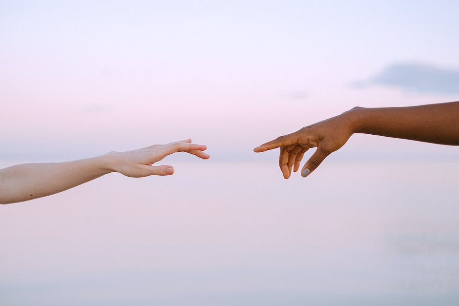 Illustration of two hands reaching towards each other, representing effective communication in family relationships