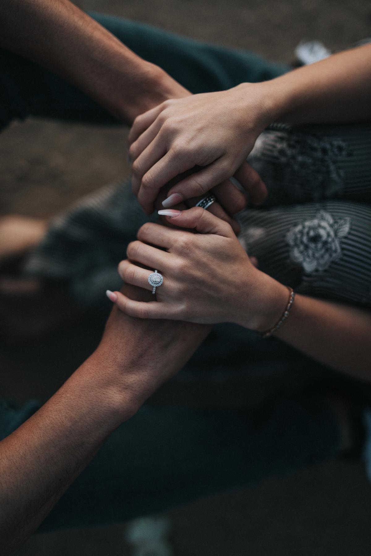 An image of a couple holding hands and smiling, showing love and connection.