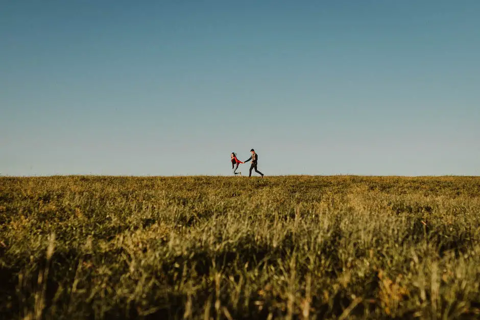 A couple holding hands and running through a field with smiles on their faces, representing the excitement and joy of spontaneity and novelty in relationships.