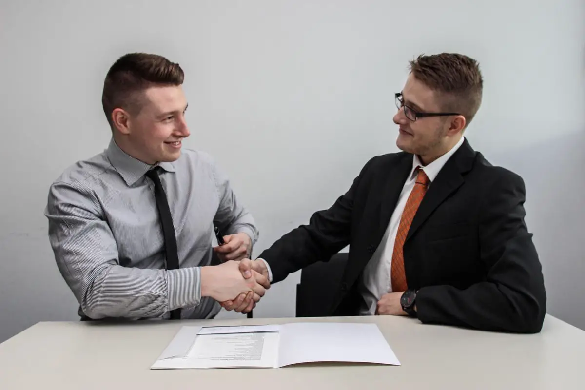 Illustration depicting two hands shaking, representing the concept of trust in relationships